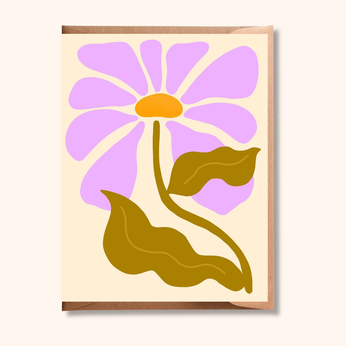 Brush & Bird's Bold Retro Daisy greeting card featuring an oversized lavender daisy with an orange centre and olive green leaves on a cream background, paired with a rose gold envelope — a vibrant any-occasion card for flower lovers.