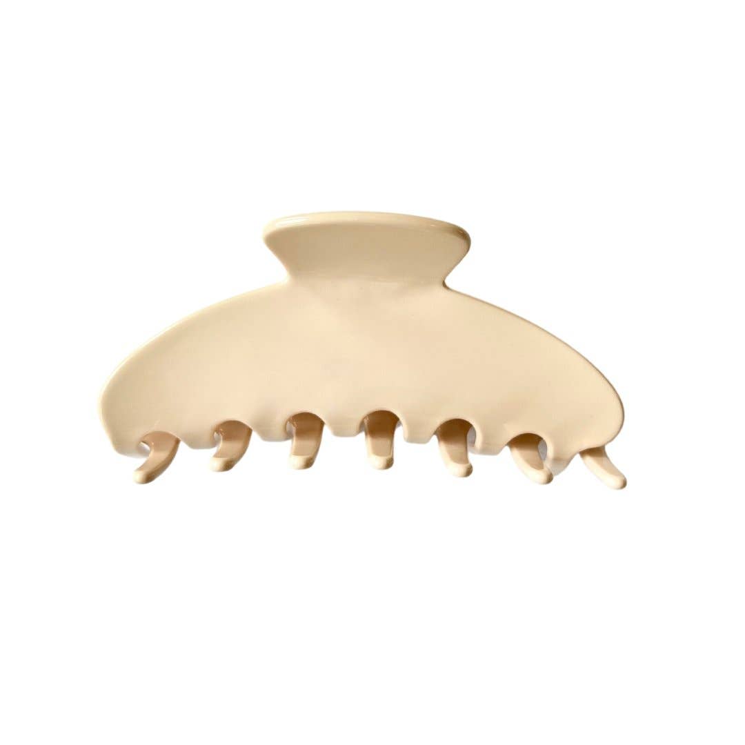 Buttercream rounded claw clip by Beyond Scrunchies, made from smooth matte cellulose acetate with curved teeth designed for an all-day hold. Made in Canada.