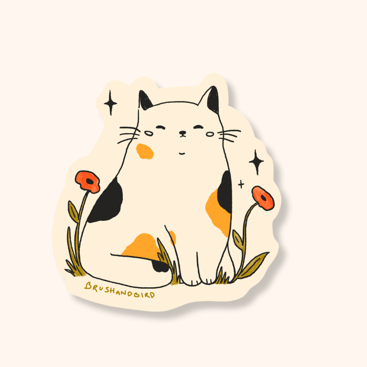 Brush & Bird's Grumpy Cat die-cut sticker featuring a chubby calico cat with black, orange, and cream markings surrounded by red poppies and sparkle details on a cream vinyl base.