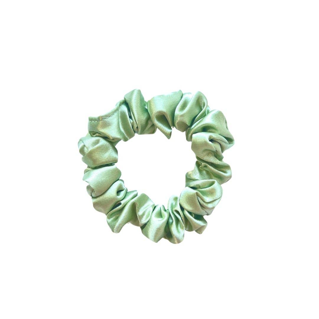 Beyond Scrunchies Sage Silk Skinny Scrunchie in a soft mint-sage green, with a delicate gathered profile ideal for fine or thin hair. Handmade in Canada.
