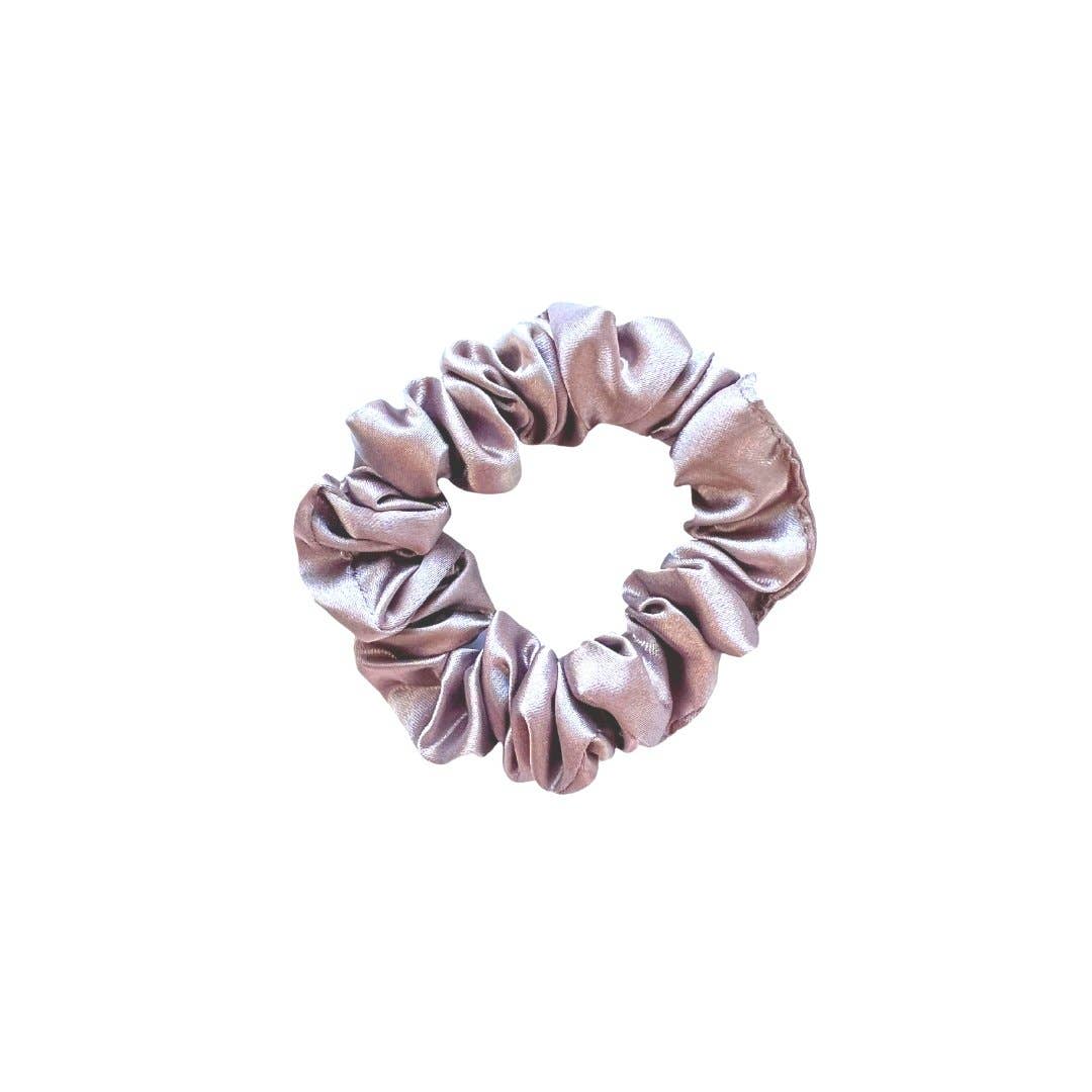 Beyond Scrunchies Haven Silk Skinny Scrunchie in a muted dusty mauve with a subtle satin sheen, slim-profile and gentle enough to wear overnight without leaving a hair dent. Handmade in Canada.
