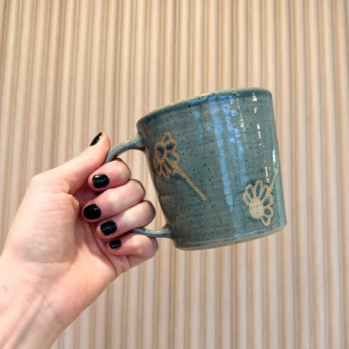 Falling daisies mug in fog colour by 
artist Stephanie Jantzen of Ceramics By Steph. Made in Sherwood Park, Alberta