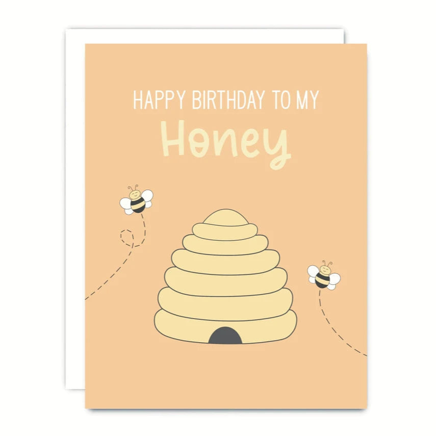 Birthday card with a beehive and bees on a peach background